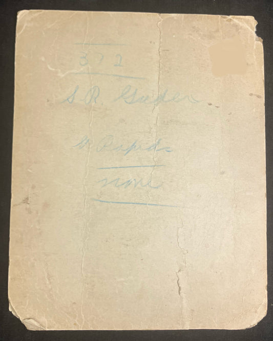 Vintage paper with handwritten text on a dark background