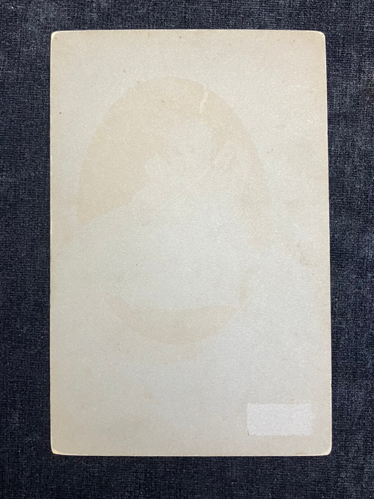 Rectangular beige card on a textured dark blue background