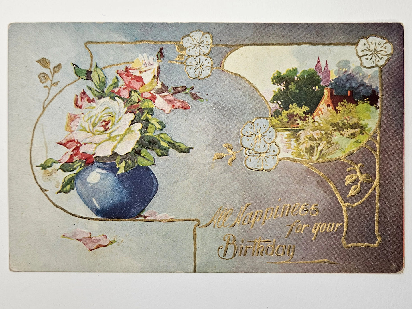 Vintage birthday card with flowers and a landscape illustration.