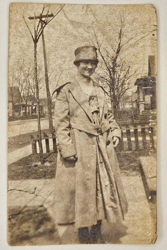 1910s-1920s Photo Of Woman In Trench Coat And Pillbox Hat - Midwest-Northeast Scene In the Front Yard - Smiling 1910s Photography