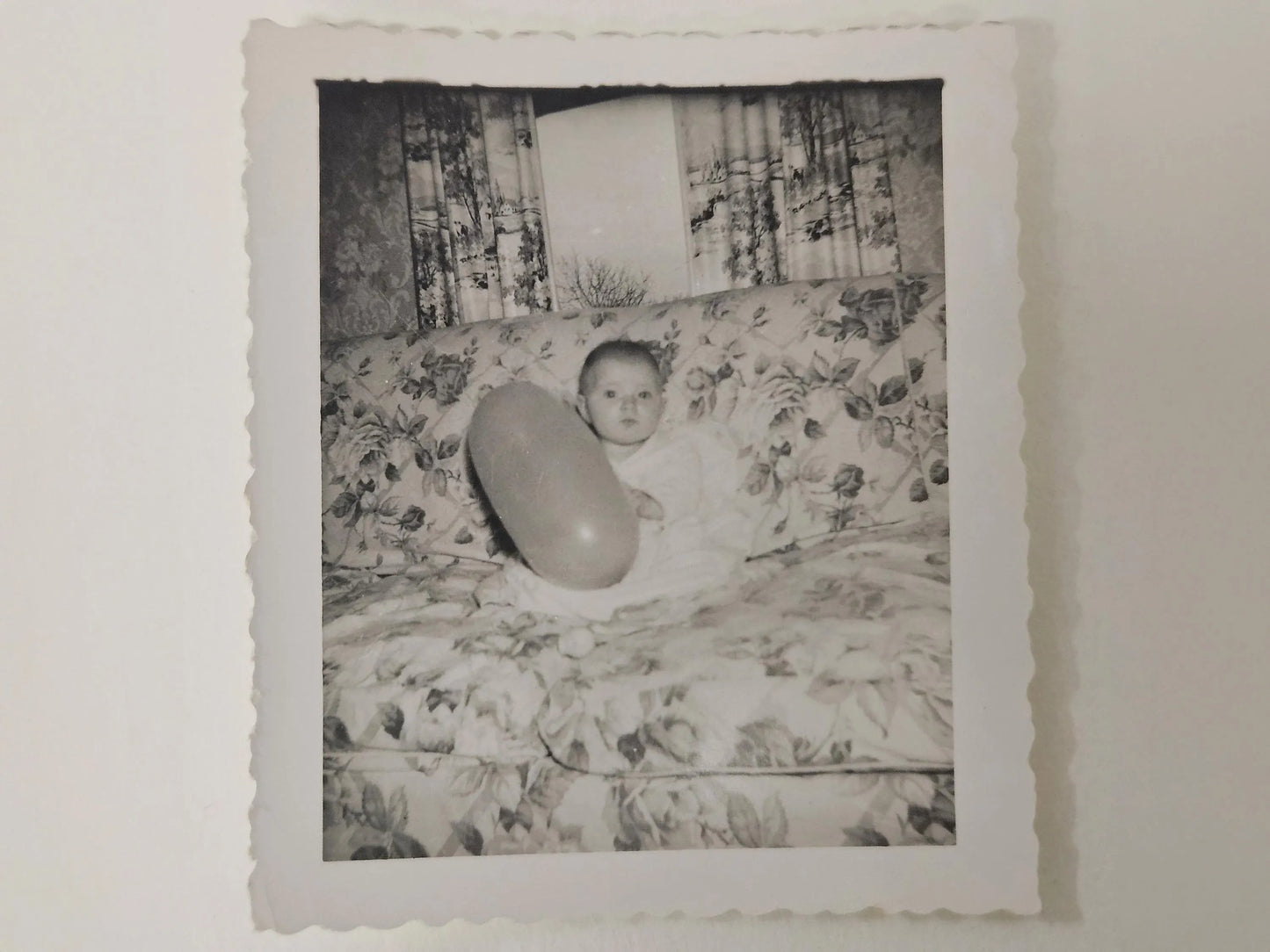 Baby With Balloon On Floral Patterned Couch - Mid Century Photo - late 1940s early 1950 Decor - 1940 black and white photo
