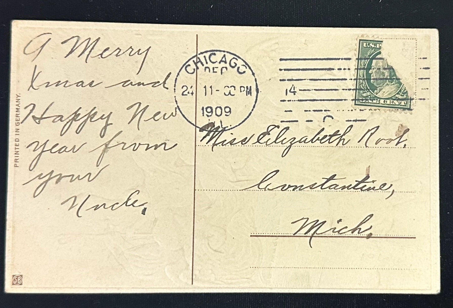 Vintage postcard with text and a stamp, dated 1909, from Chicago, Illinois.