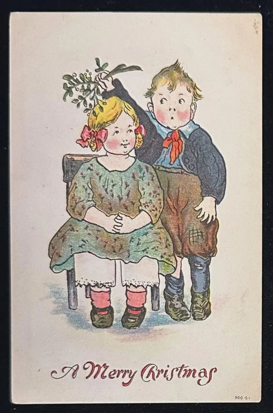 Vintage Christmas card with children holding mistletoe, text 'A Merry Christmas'.