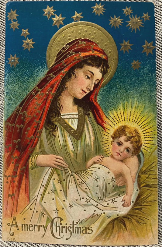 Vintage-style Christmas card with Mary holding baby Jesus, surrounded by stars.