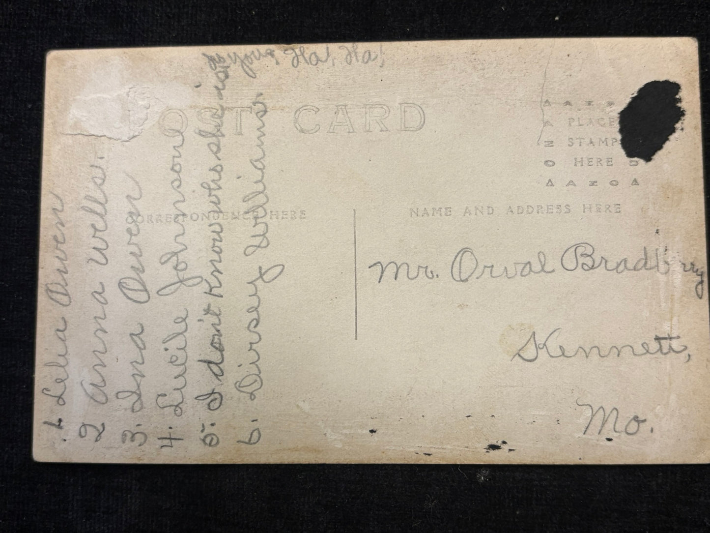 Vintage postcard with handwritten text on a black background