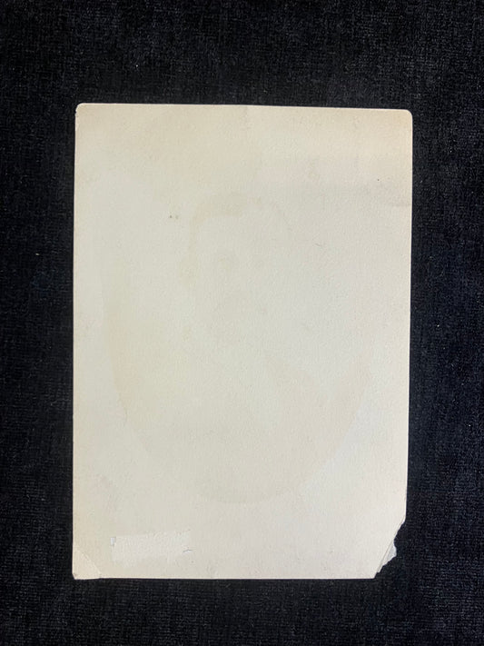 Rectangular white card on a black background