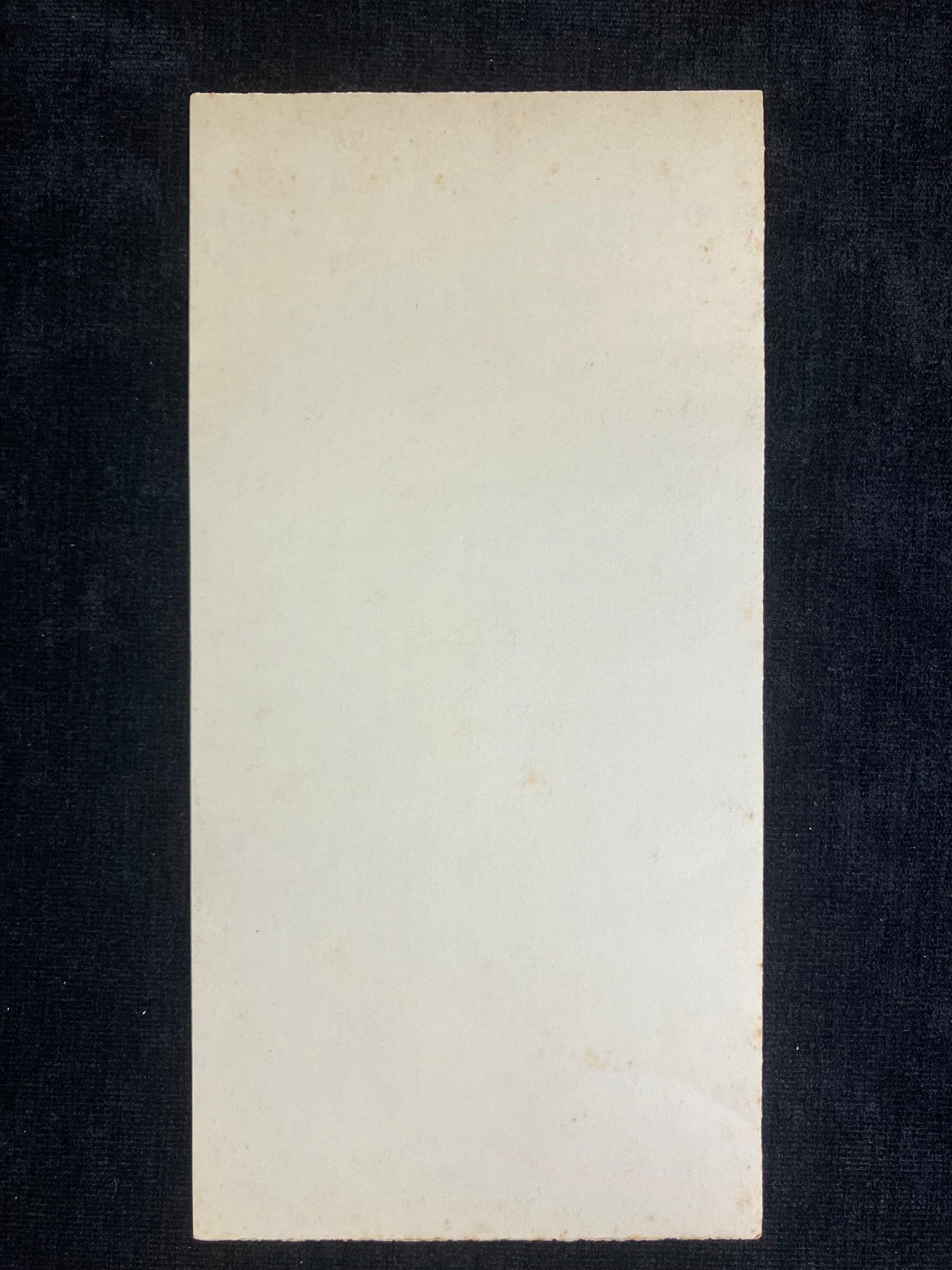 Rectangular white card on a black background