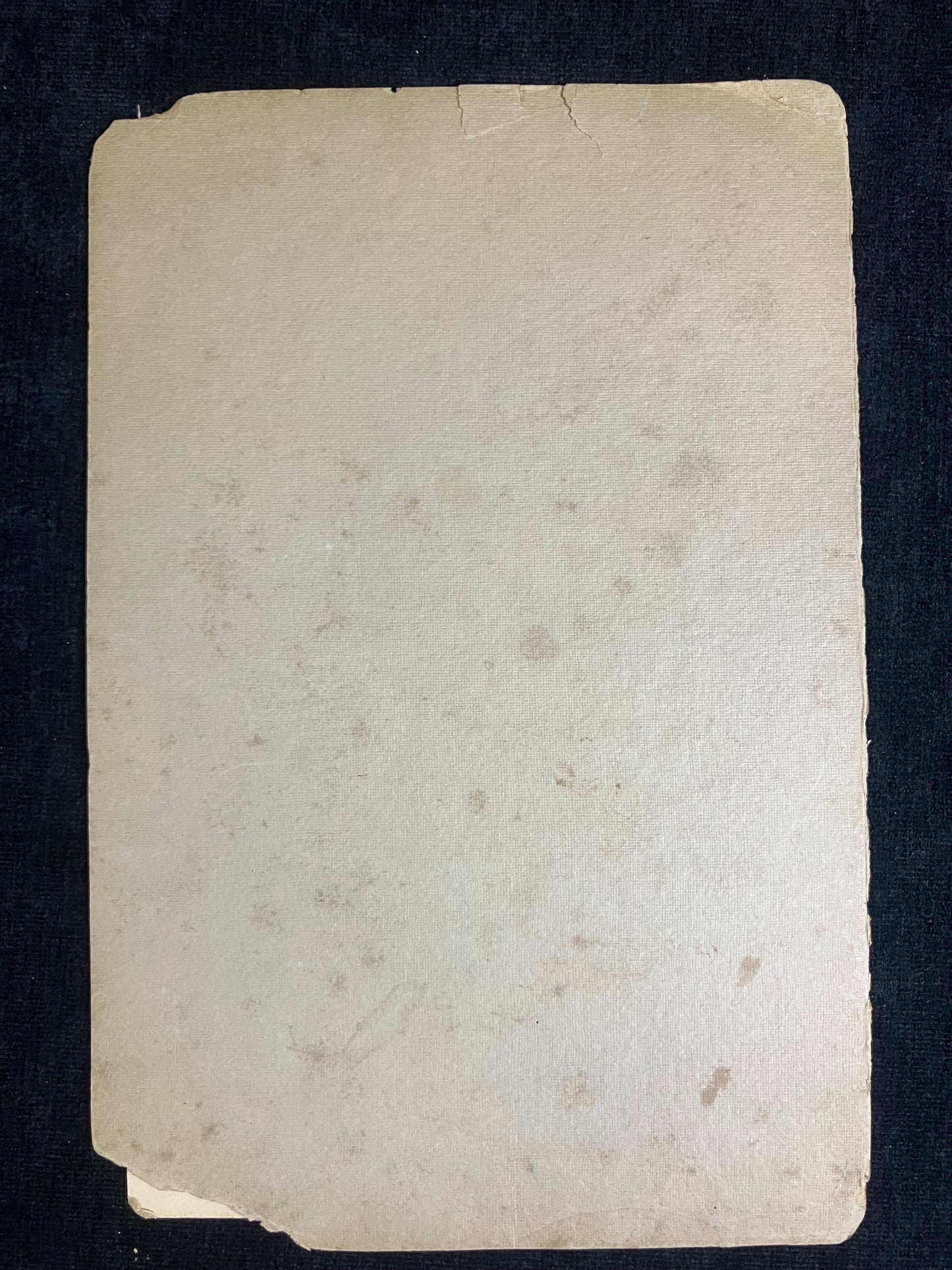 Vintage paper card with a textured surface on a black background
