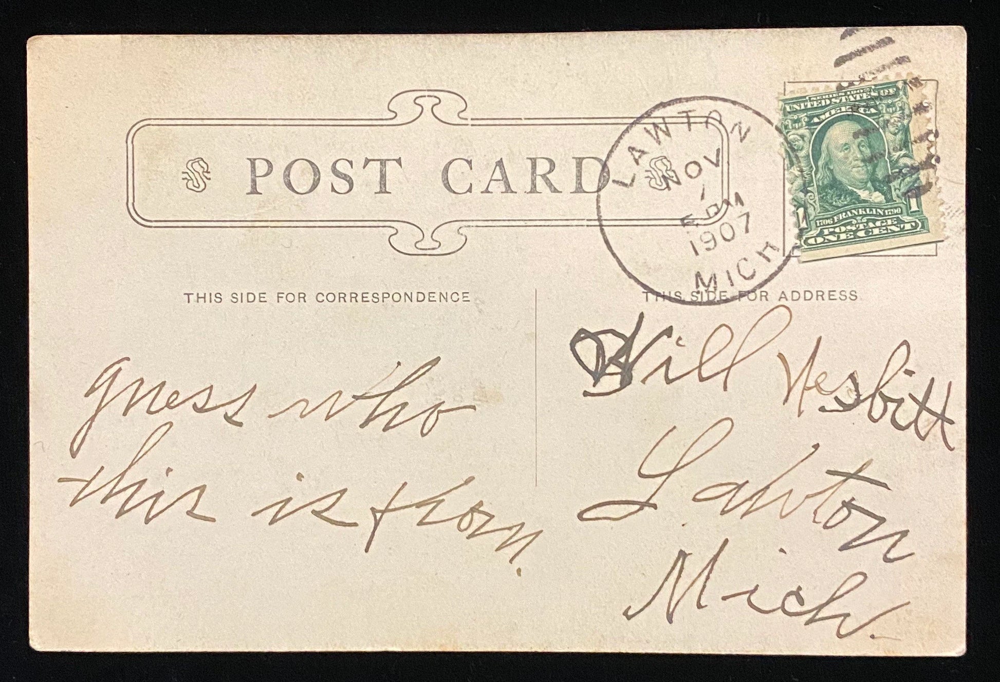 Vintage postcard with postage stamp and handwritten text, featuring a stamp from Lawton, Michigan.