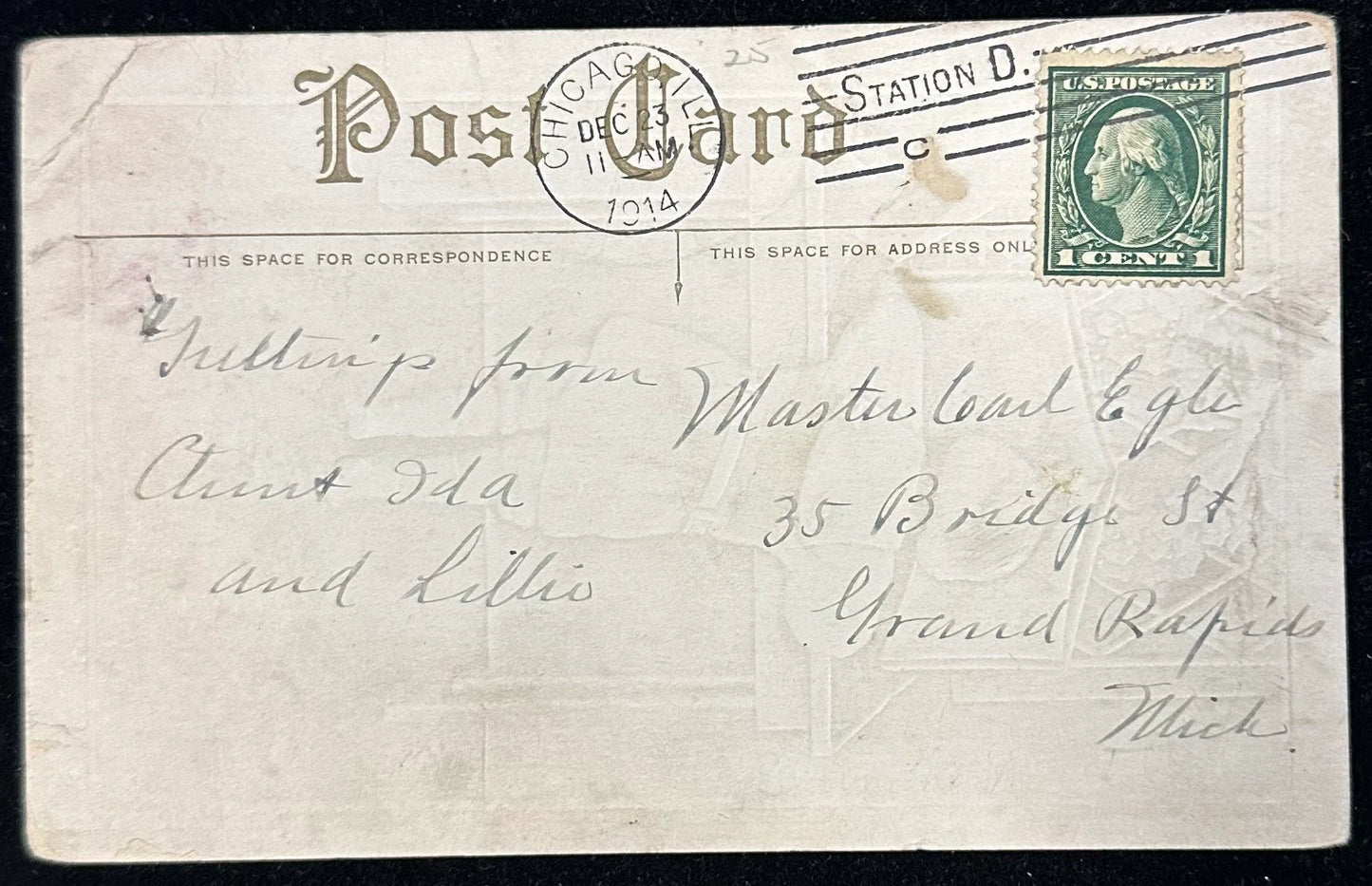 Vintage postcard with a stamp and handwritten text, featuring 'Chicago Post Card Station D' on a black background.