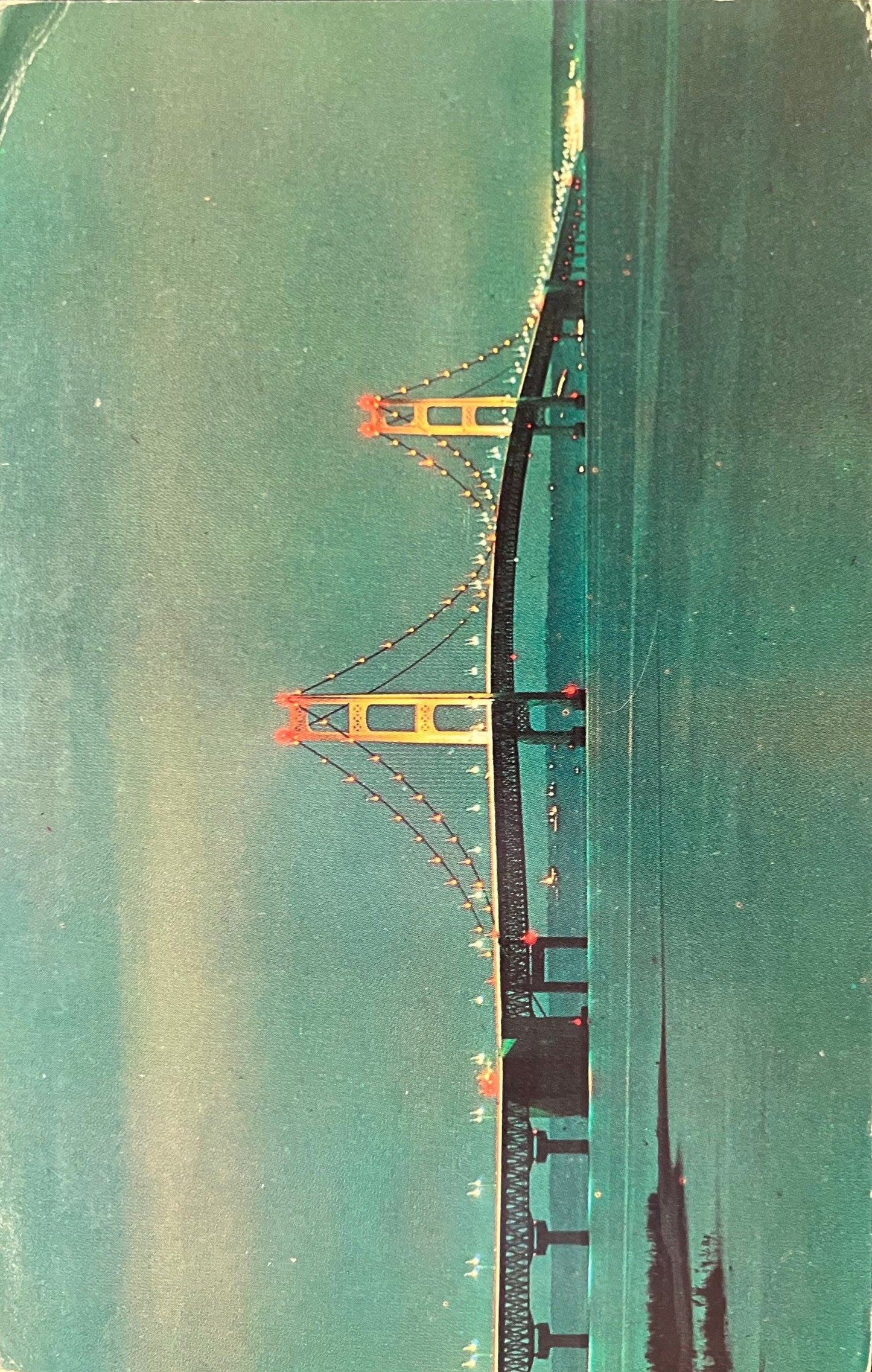 Mackinaw City, Michigan a View at Dusk of the “Mighty Mac” - Photo by J. V. Pontiere - Vintage Postcard