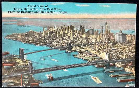 Aerial View of Lower Manhattan from East River Showing Brooklyn and Manhattan Bridges. - Vintage Postcard with hand tinted photo