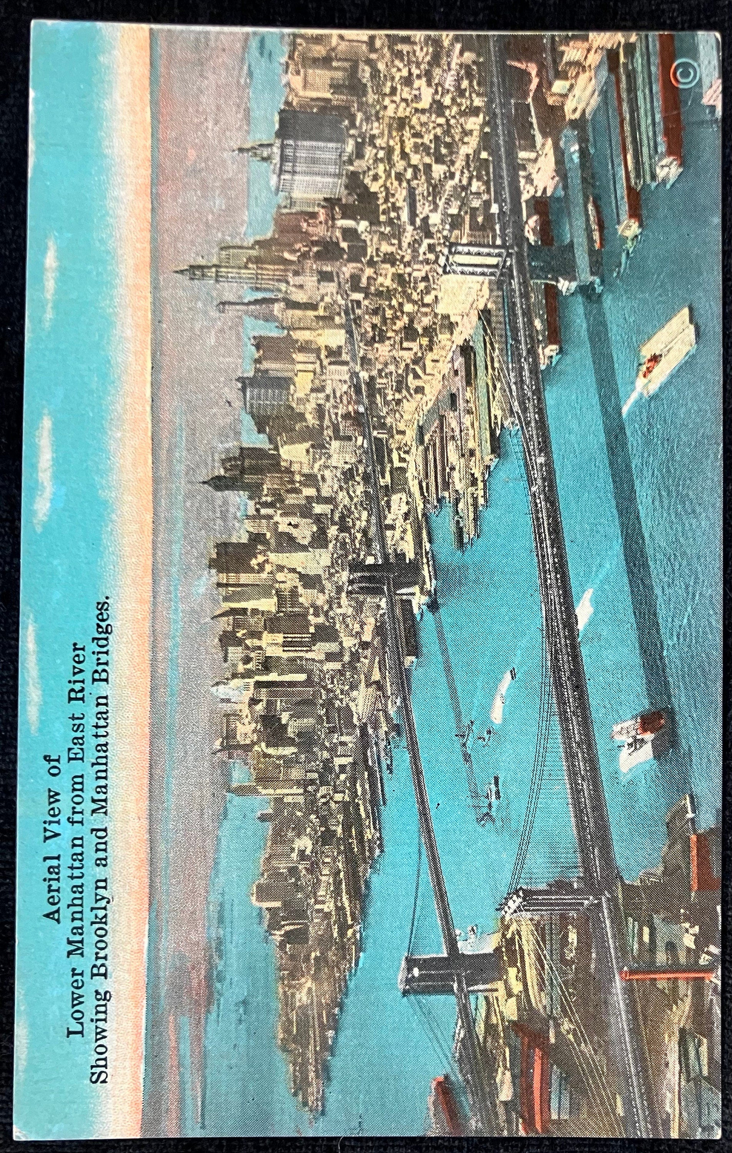 Aerial View of Lower Manhattan from East River Showing Brooklyn and Manhattan Bridges. - Vintage Postcard with hand tinted photo