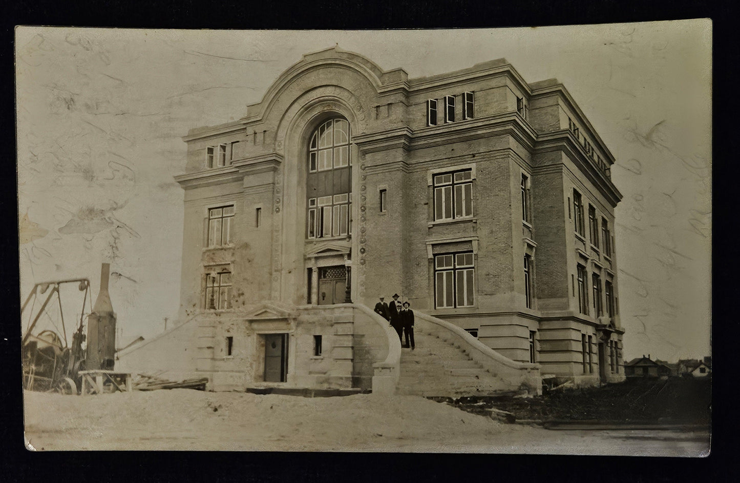 RPPC - Four Men Standing on Steps of a 3.5 Storied Brick Building in Detroit, Michigan - The Building looks to be under construction - Sepia colored