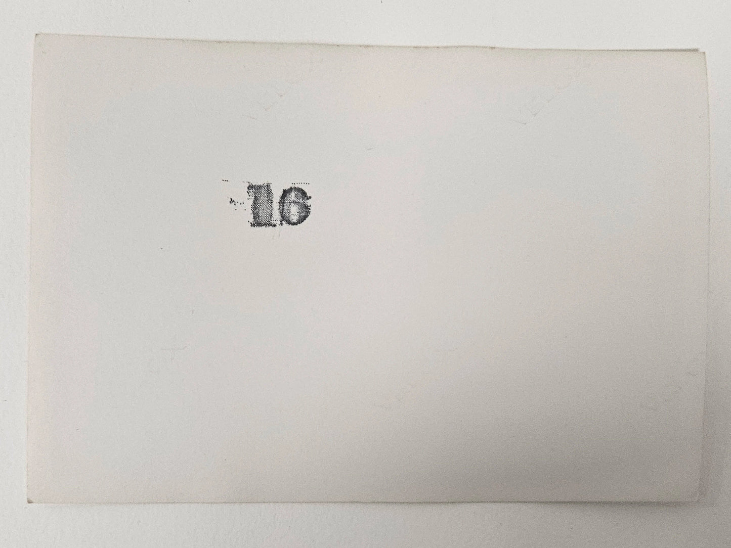 Baby Girl In White Outfit with Sun Bonnet - Holding a large Top Smiling - Spring Baby Photo - Black and White Photograph 1950s