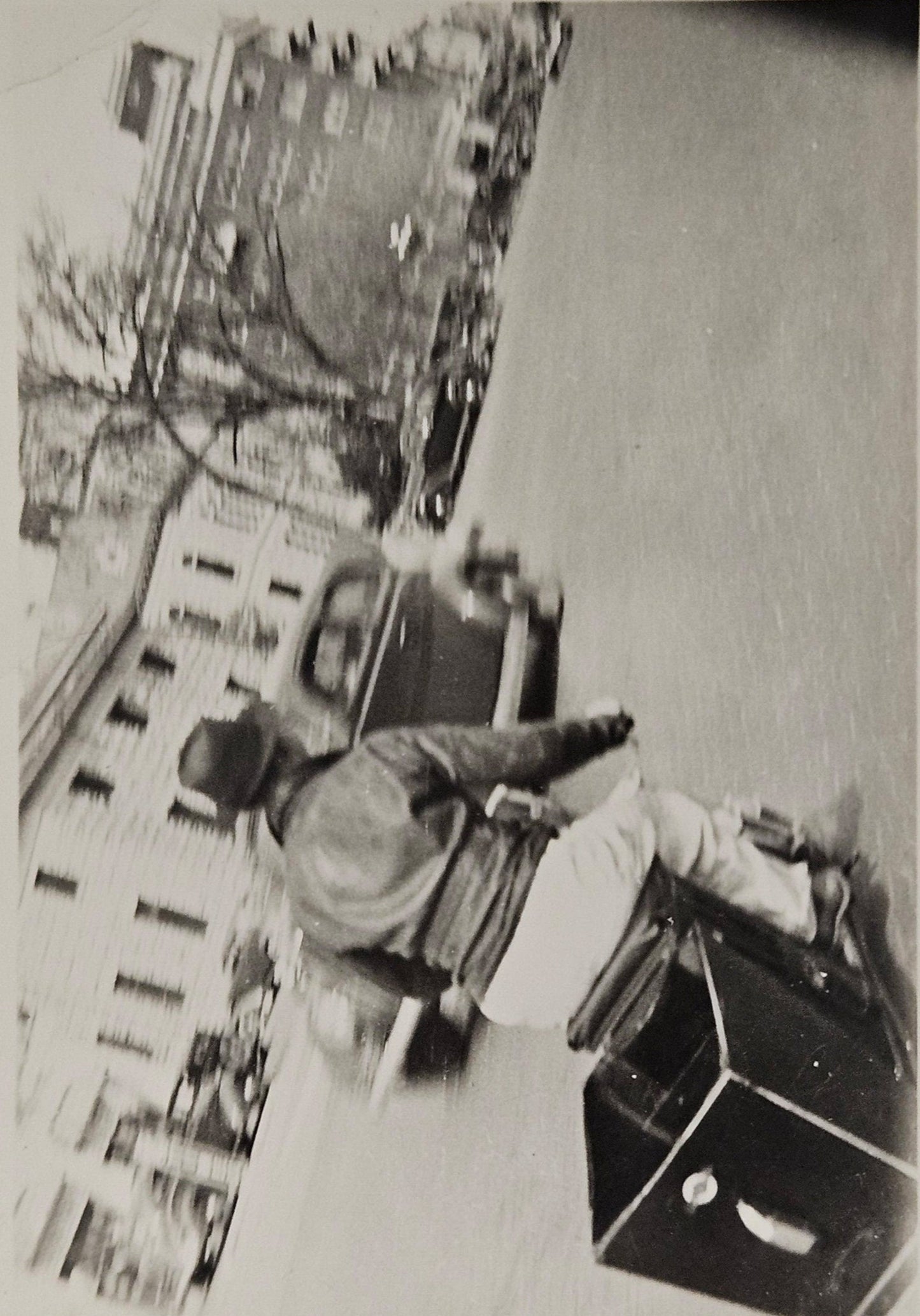 1940s Black and White Motion Photography - Man Traveling On Scooter/Motorcycle - City Street With Tr