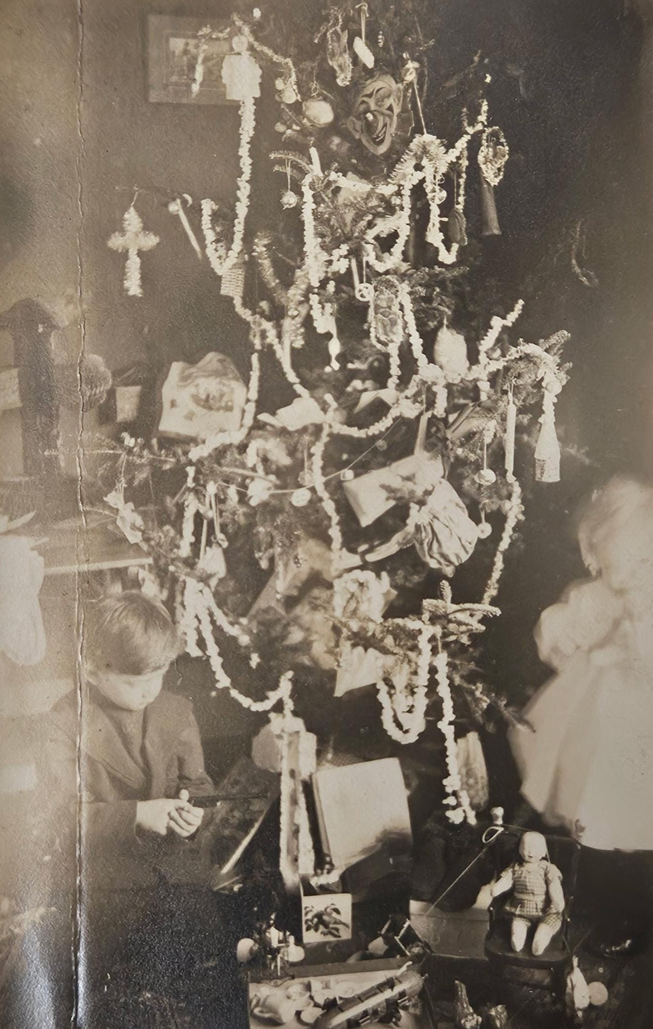RPPC - Early 1900s Christmas Tree - Decorated With Tinsel and Popcorn Garlands, Masks, Toys and More - Children Opening Gifts under Tree