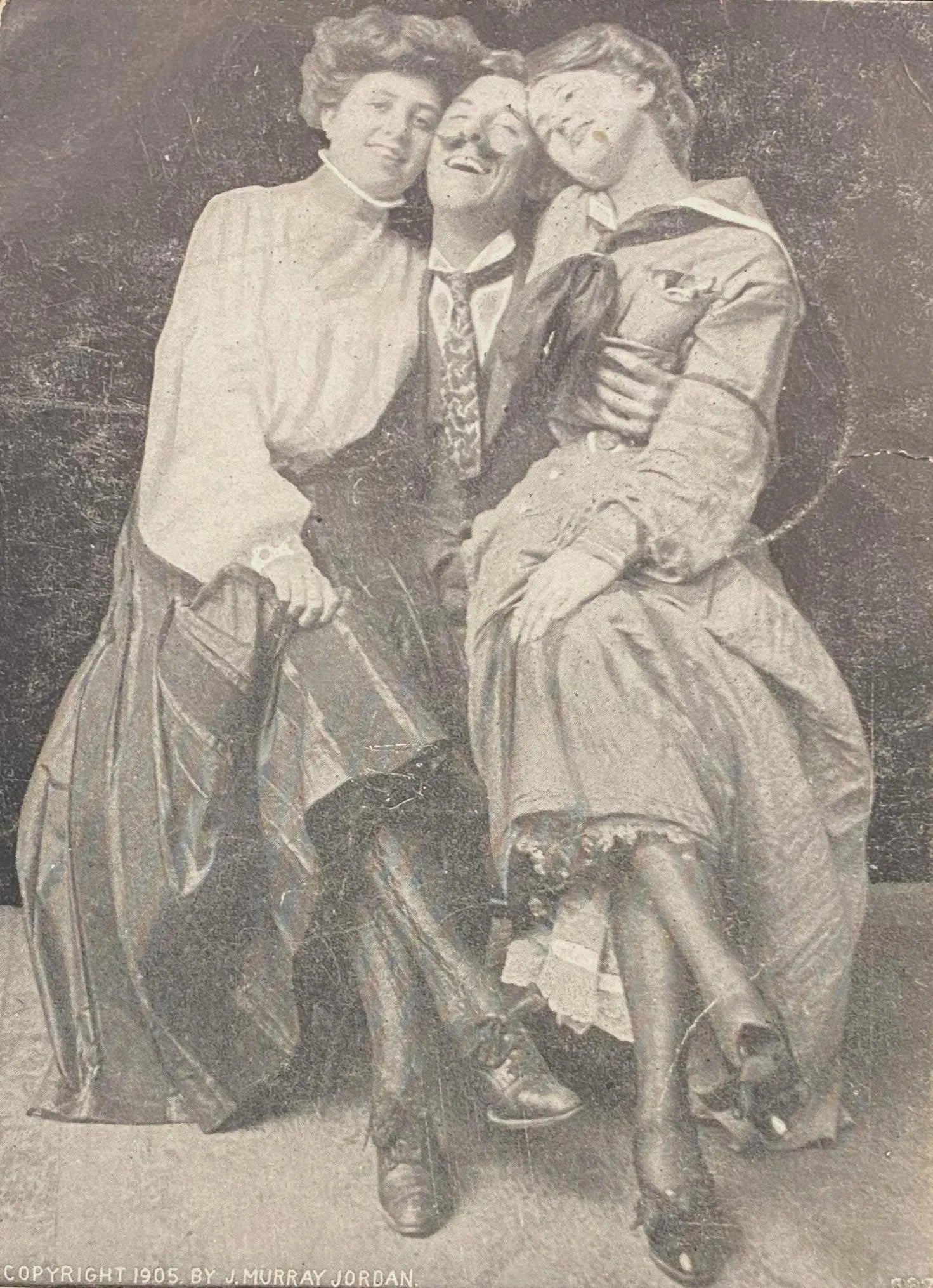 Three people posing together in a vintage romance photograph