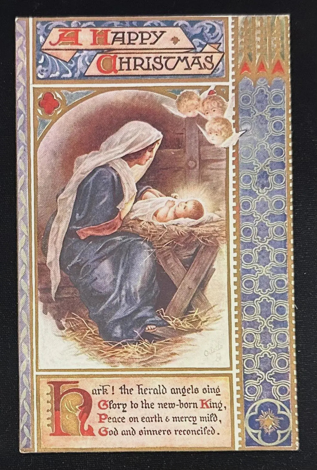 Vintage Christmas card with nativity scene and decorative border