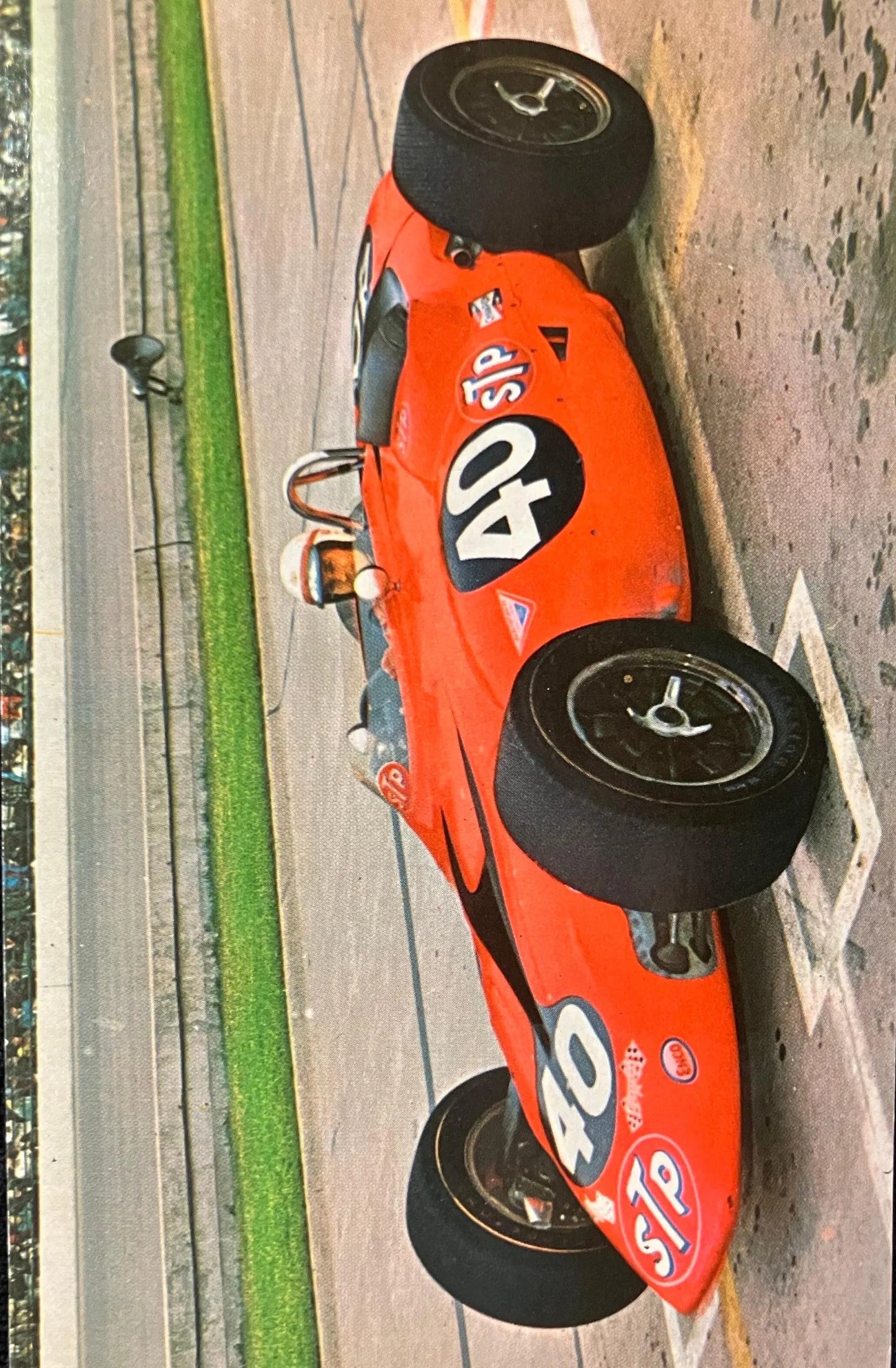 Red race car with number 40 on a racetrack