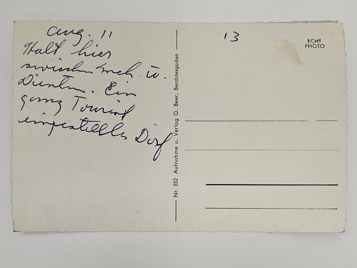 Vintage postcard with handwritten text on a plain background