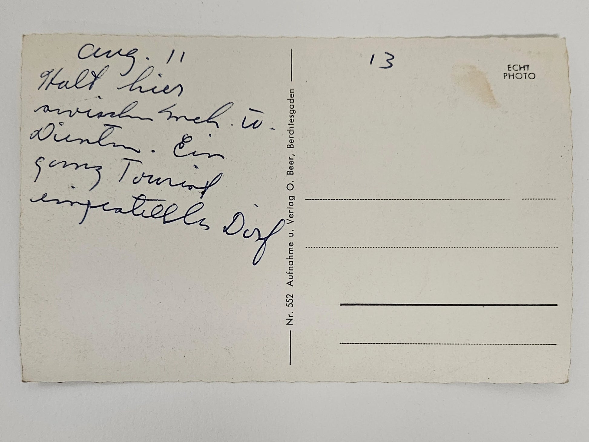 Vintage postcard with handwritten text on a plain background