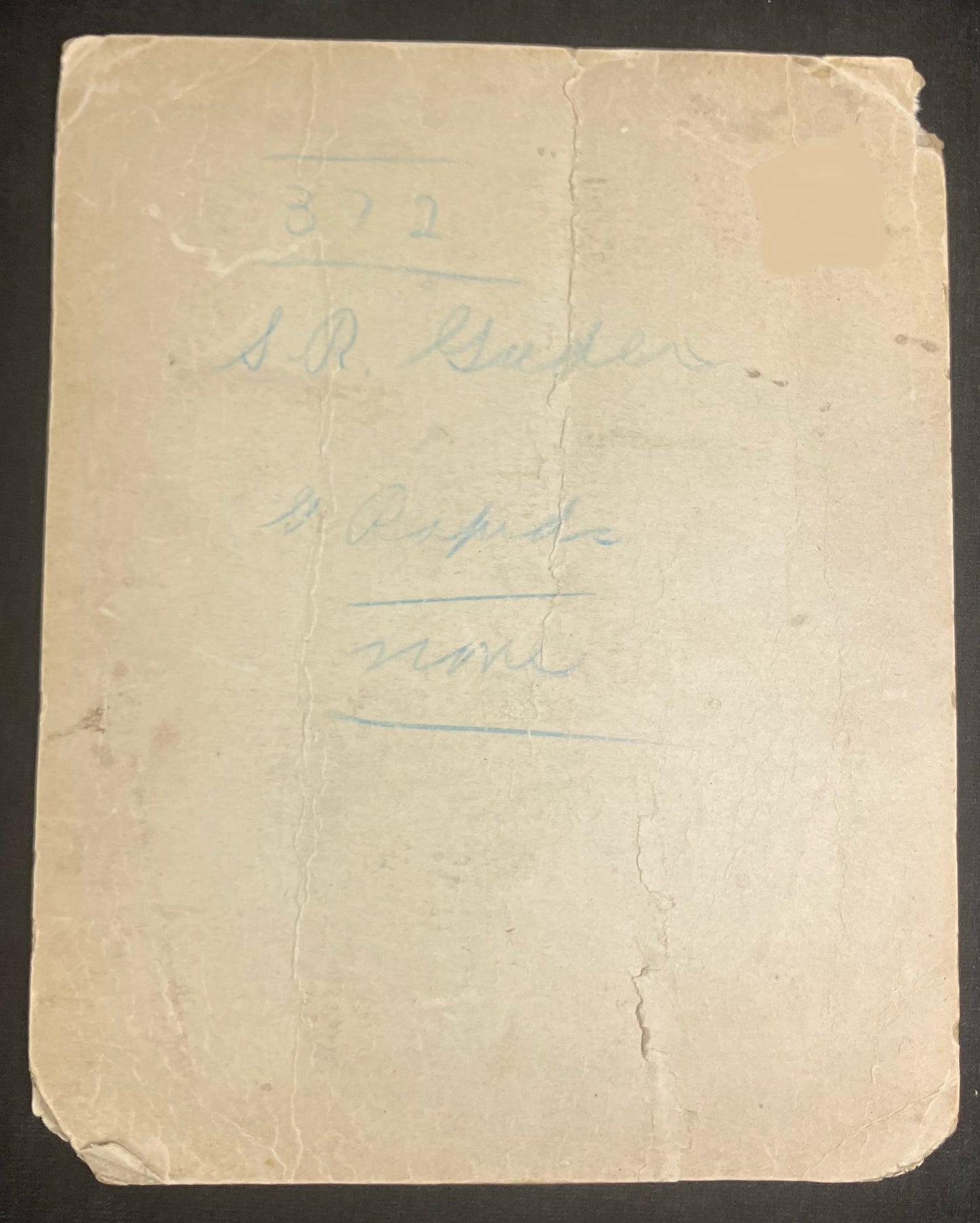 Vintage paper with handwritten text on a dark background