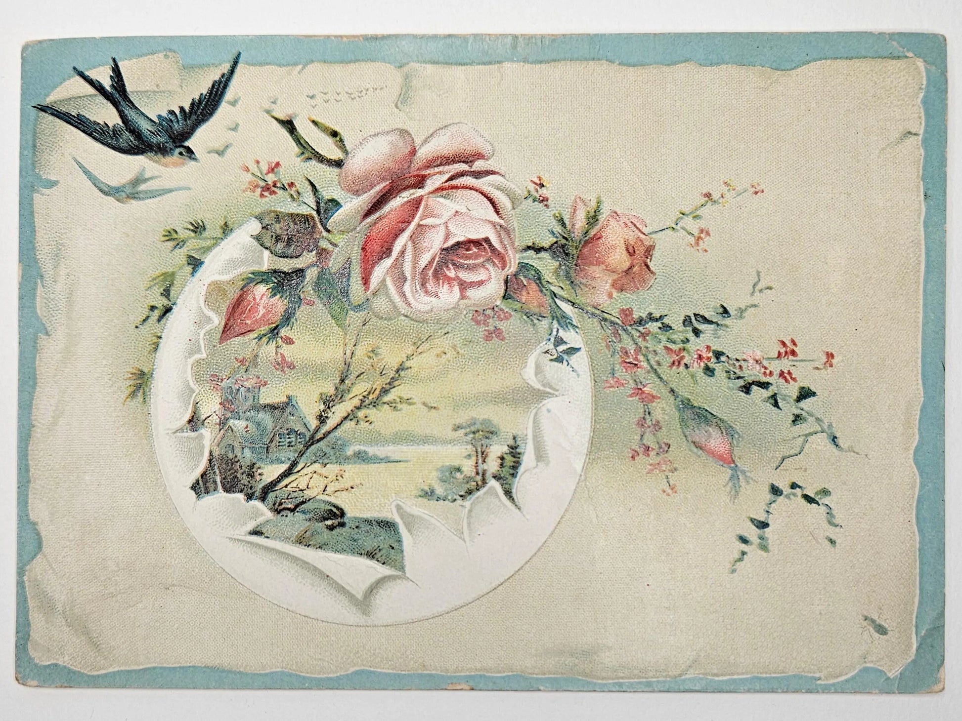Vintage trade card with flowers, birds, and a decorative border on a textured background.