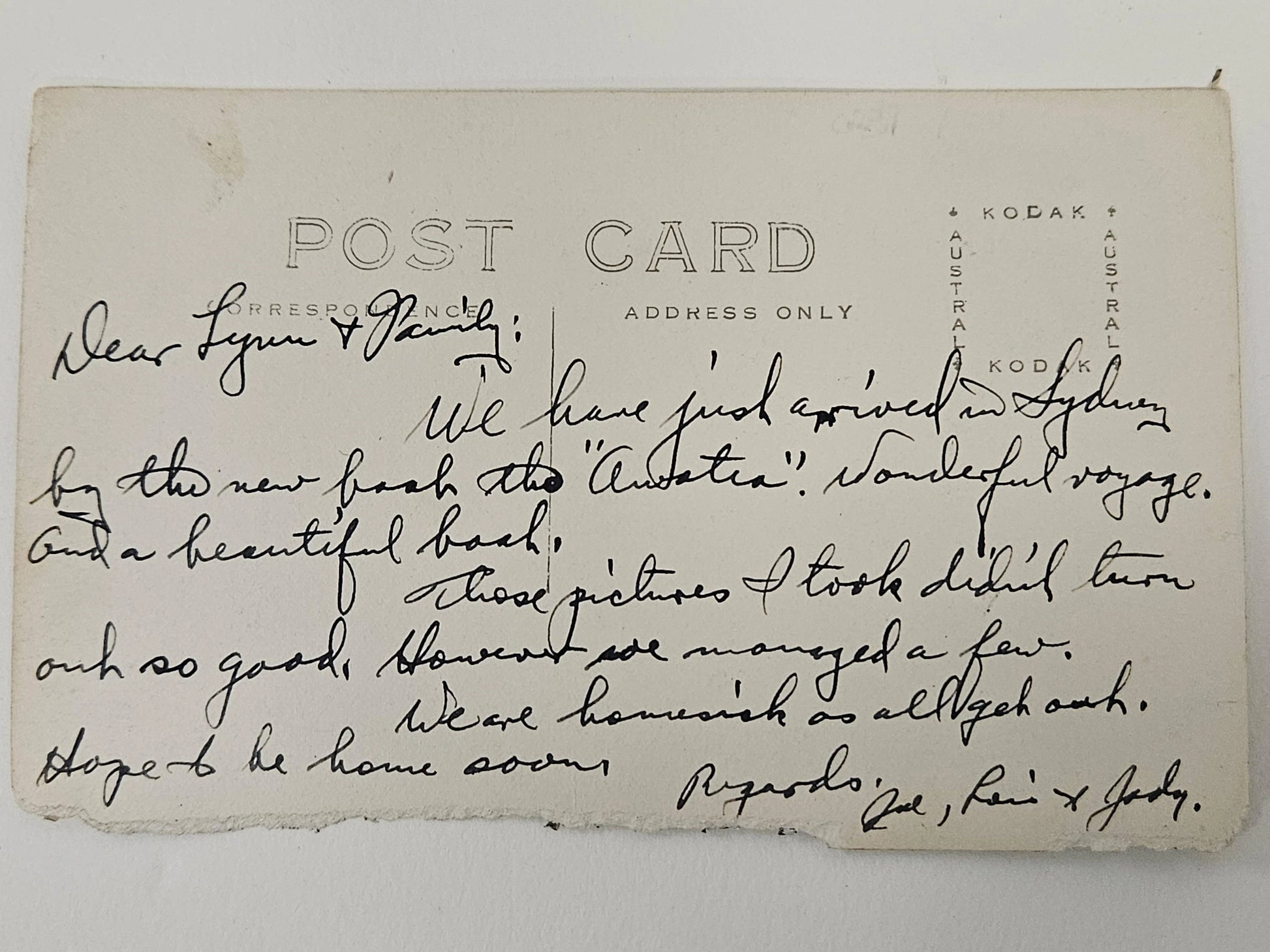 Vintage postcard with handwritten text on a white background