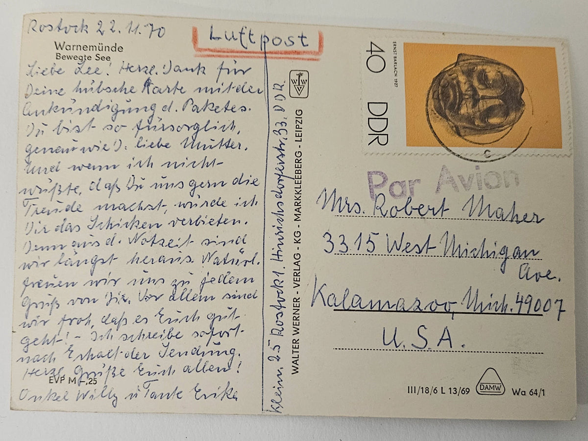 Vintage Luftpost postcard with handwritten text and postage stamp, addressed to a U.S. recipient.