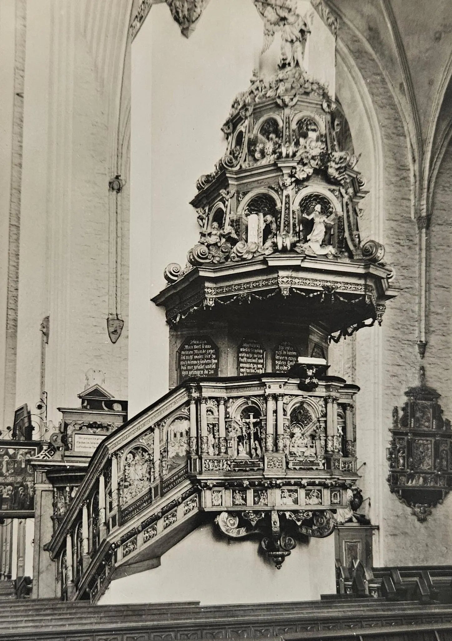 Decorative pulpit in a church with intricate carvings and statues.