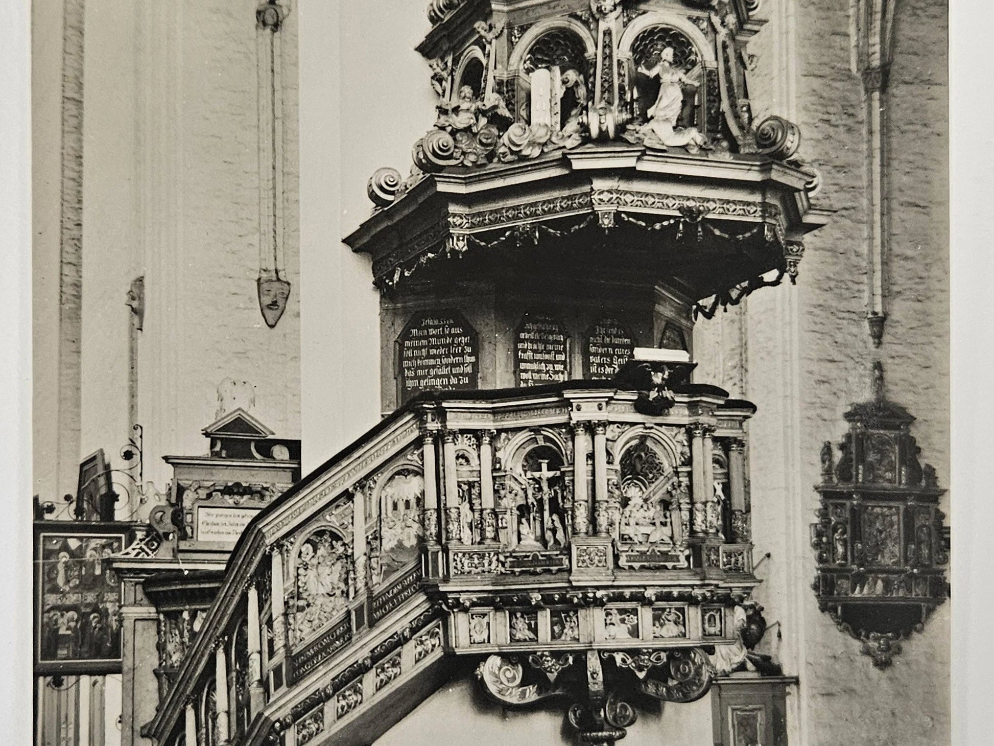 Decorative pulpit in a church with intricate carvings and statues.
