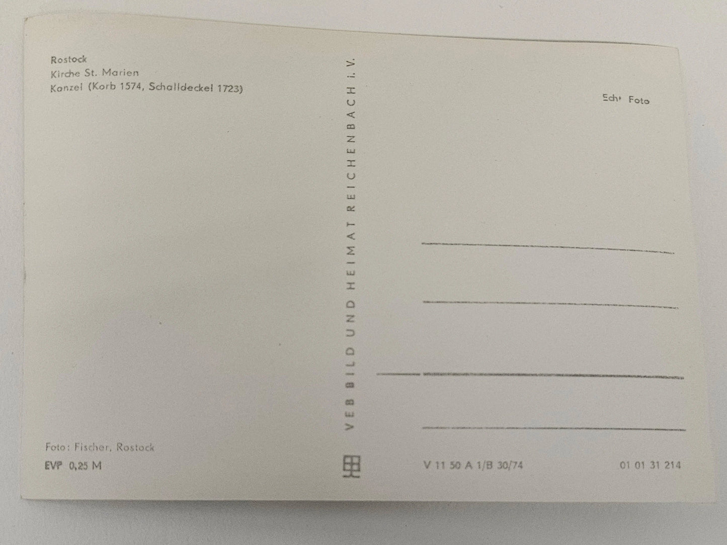 Back of a postcard with text and design elements on a white background