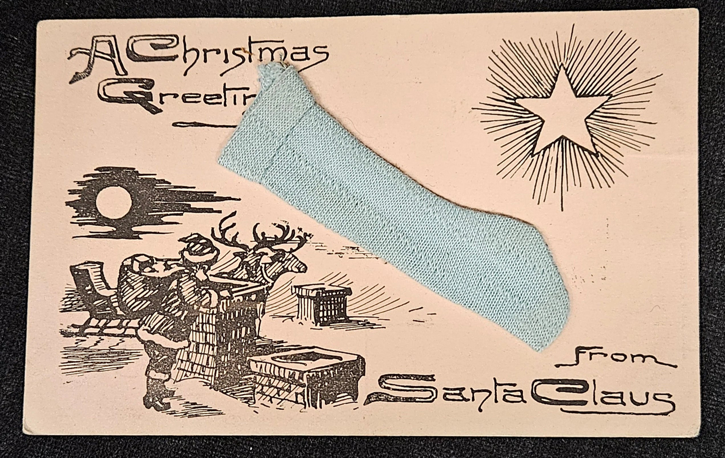 Vintage-style Christmas card with Santa Claus and reindeer, featuring a star and text.