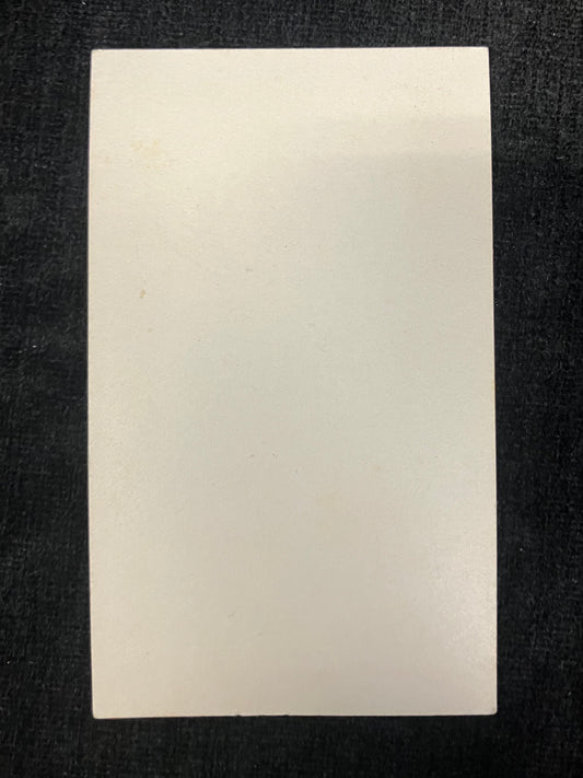 Beige rectangular card on a black background