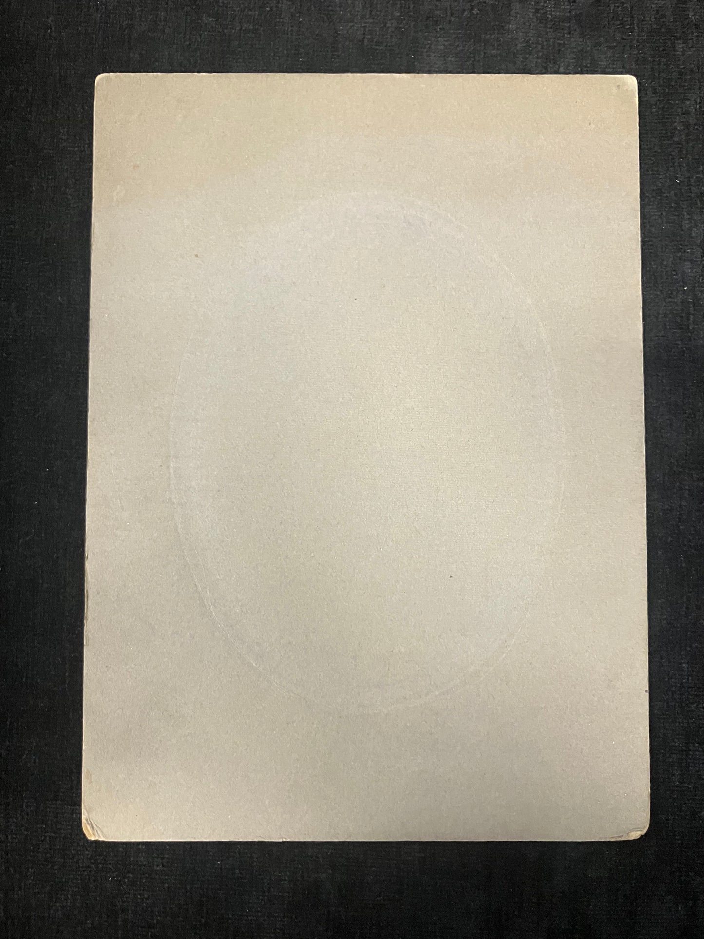 Rectangular beige card on a black background