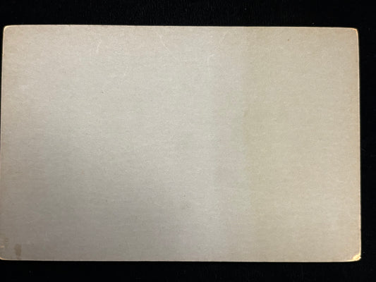 Rectangular white card with a textured surface on a black background