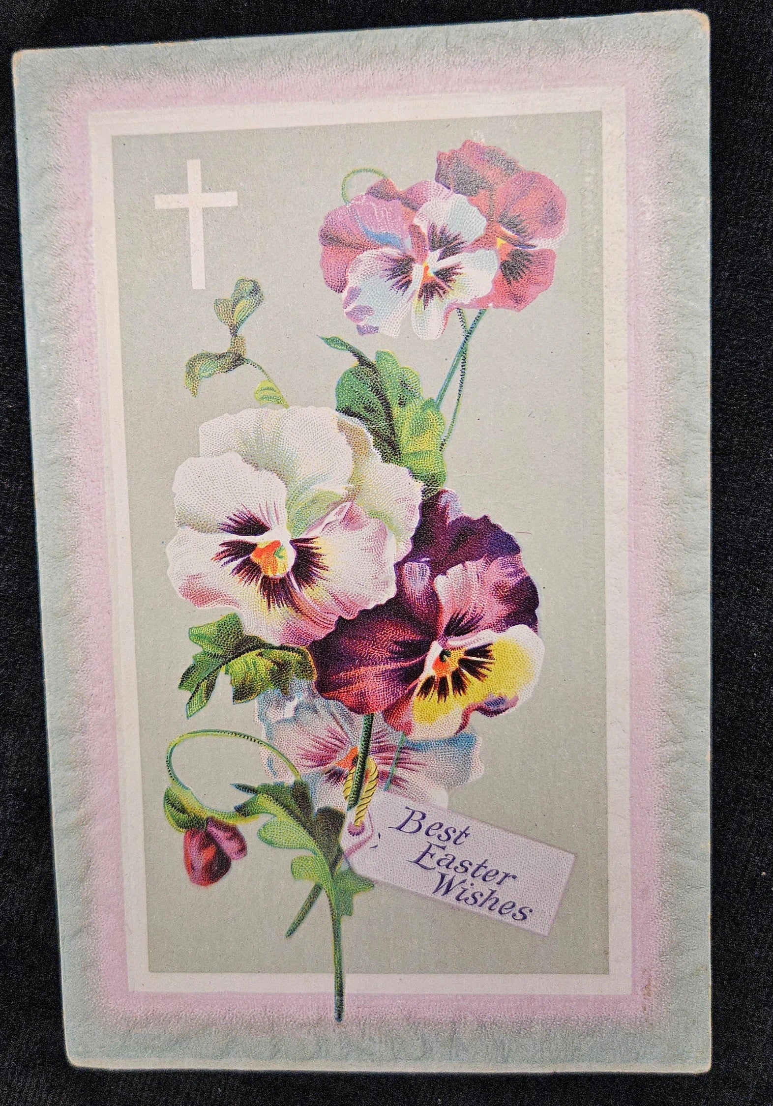 Vintage Easter card with colorful flowers and a cross on a dark background