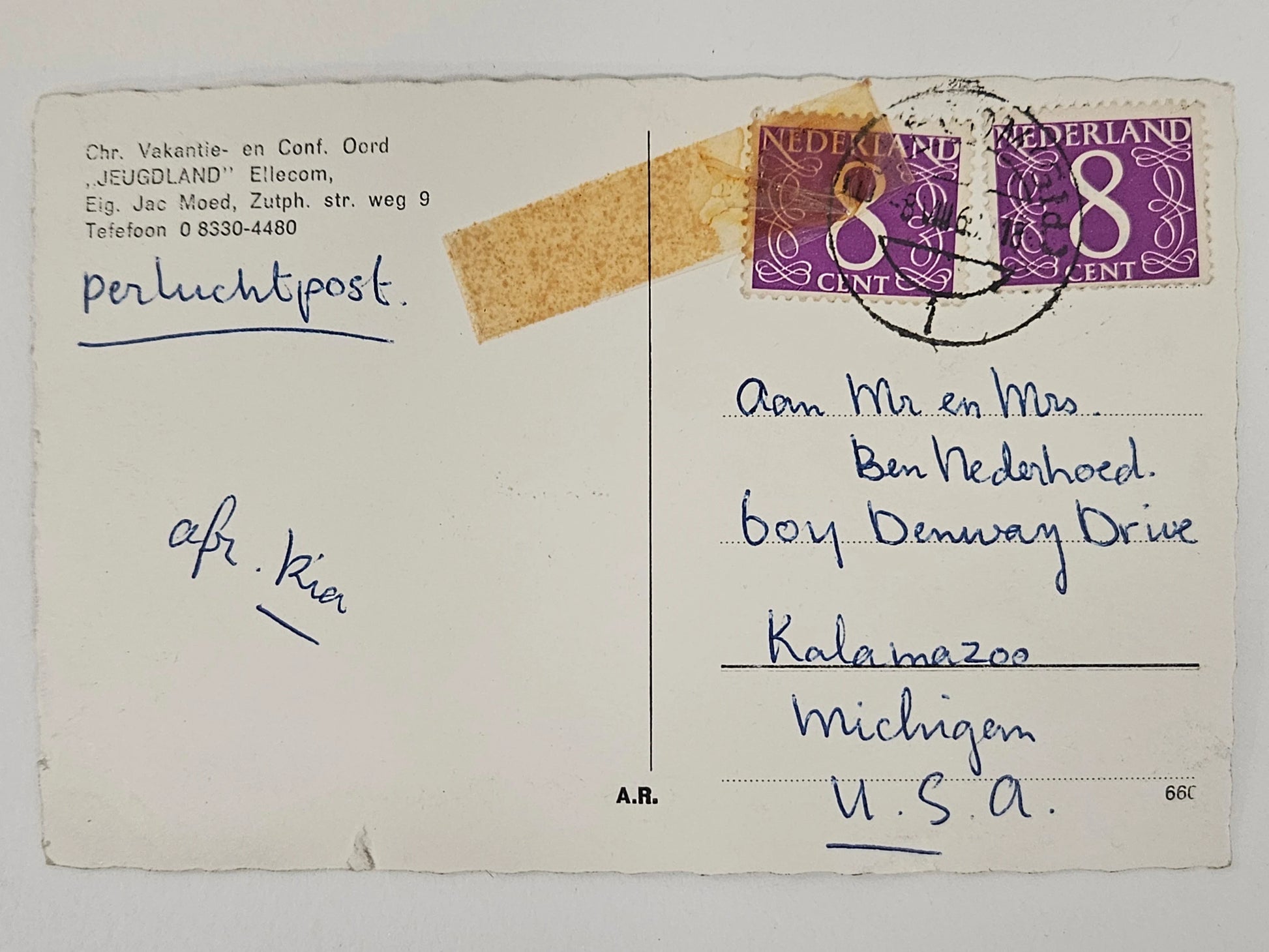 Vintage postcard with a stamp and handwritten text on a white background
