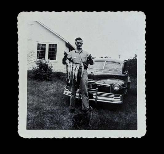 Black and White Photo of A New Car, a Cigarette, and a Bunch of Fish