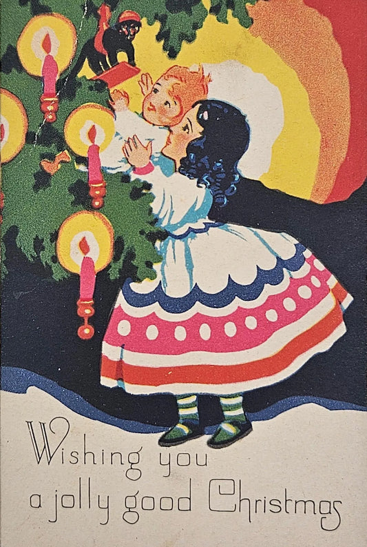 Children Looking at Monkey Sitting in Christmas Tree With Ornaments and Candles - "Wishing You A Jolly Good Christmas" - Christmas Postcard