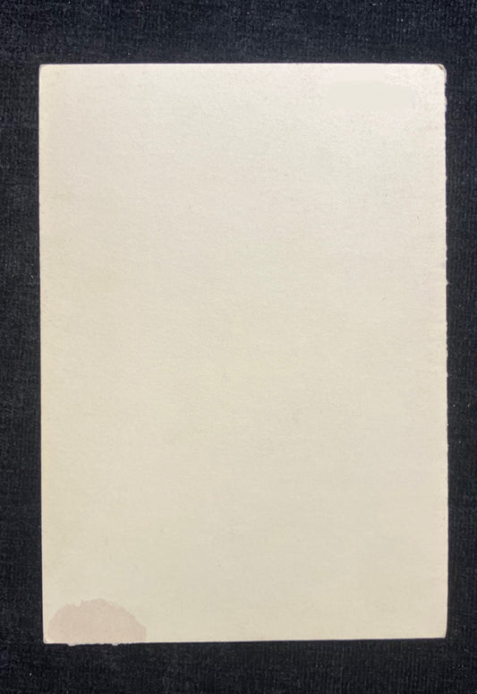 Rectangular beige card on a dark background