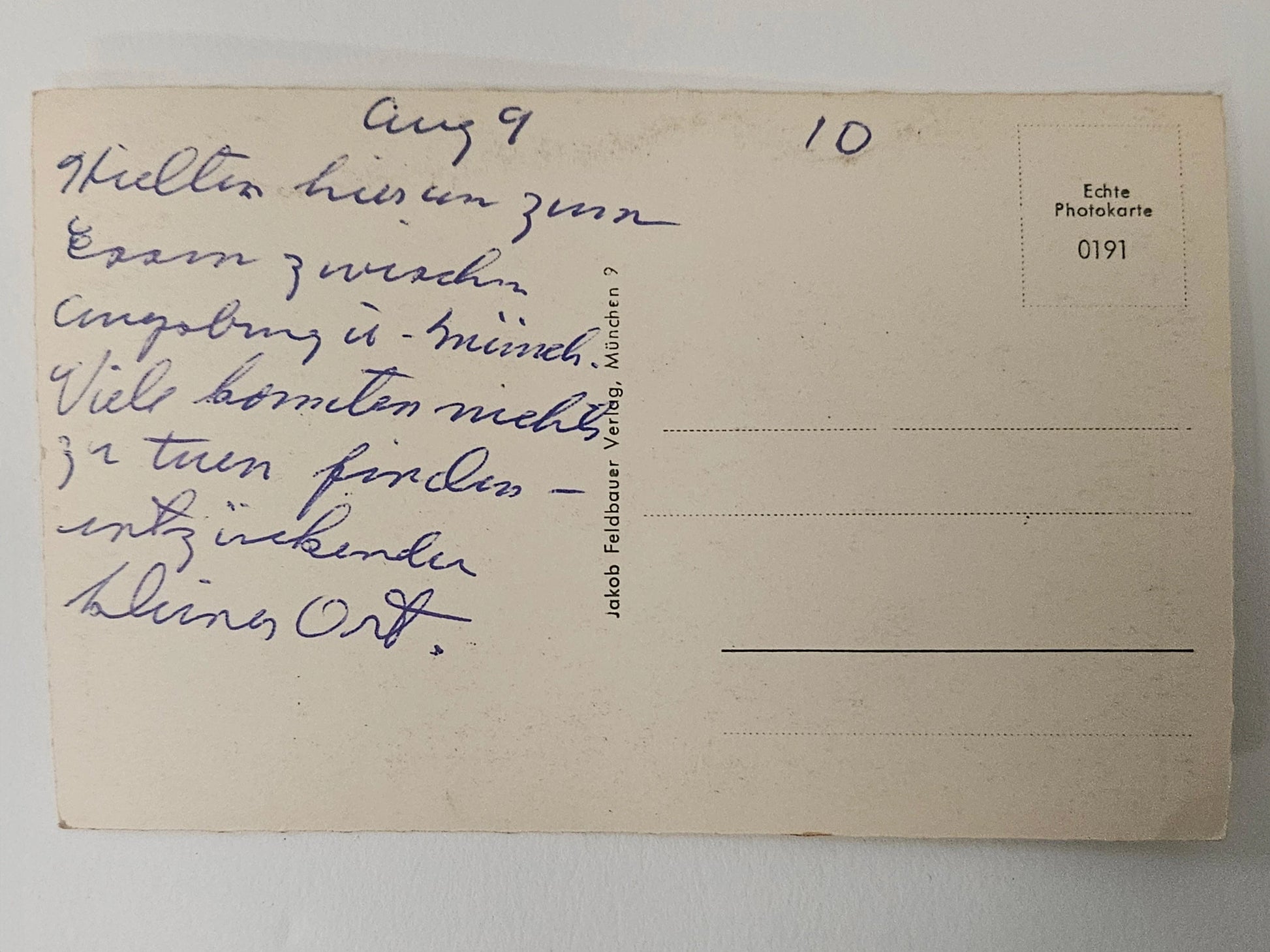 Vintage postcard with handwritten text on a plain background