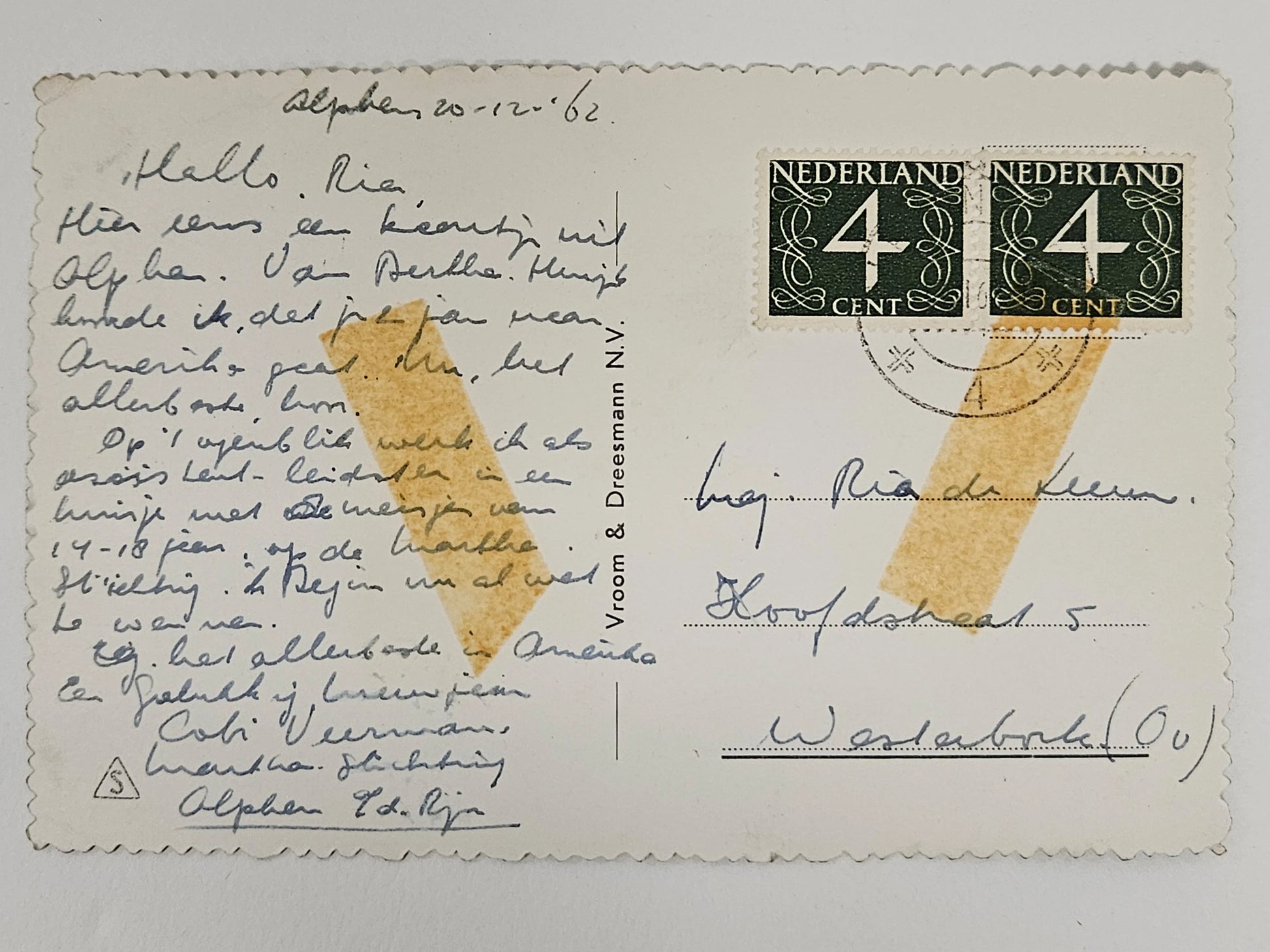 Vintage postcard with handwritten text and postage stamps, featuring a yellow stain.