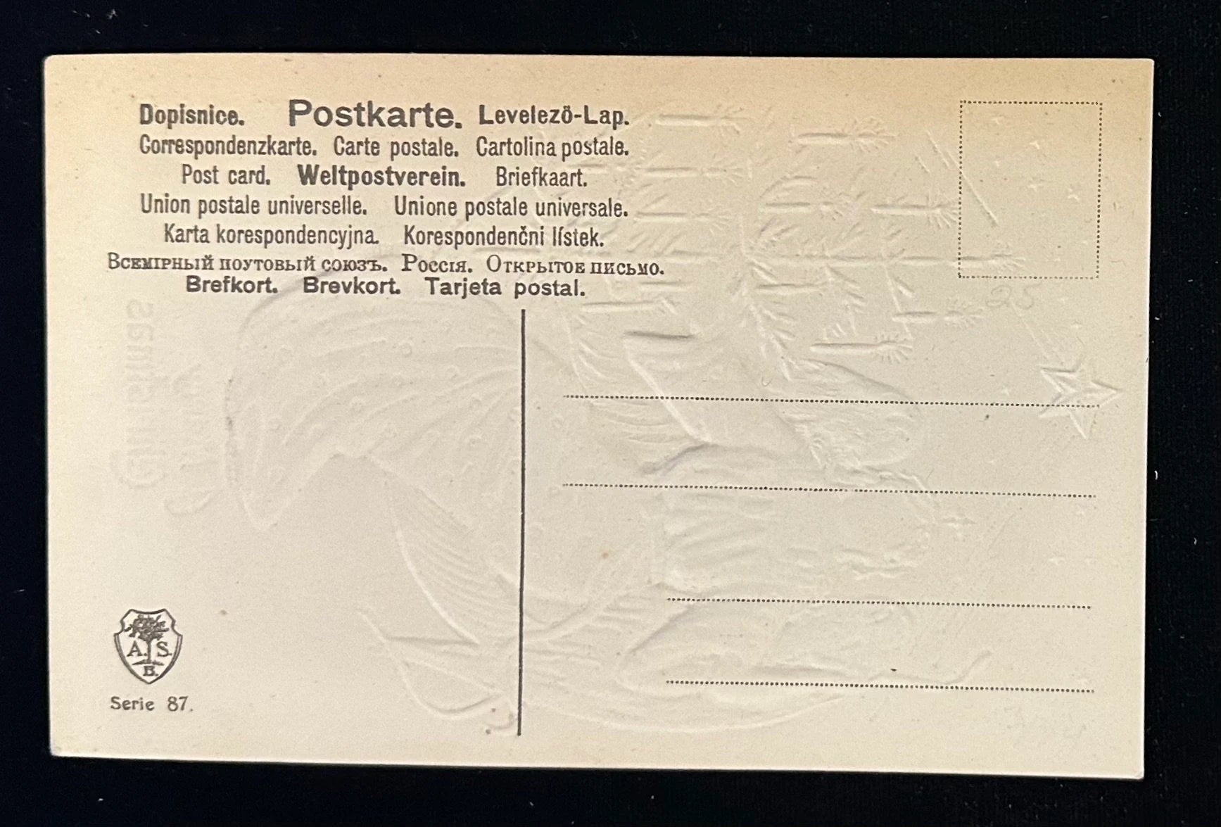 Back of a vintage postcard with text and a logo on a beige background