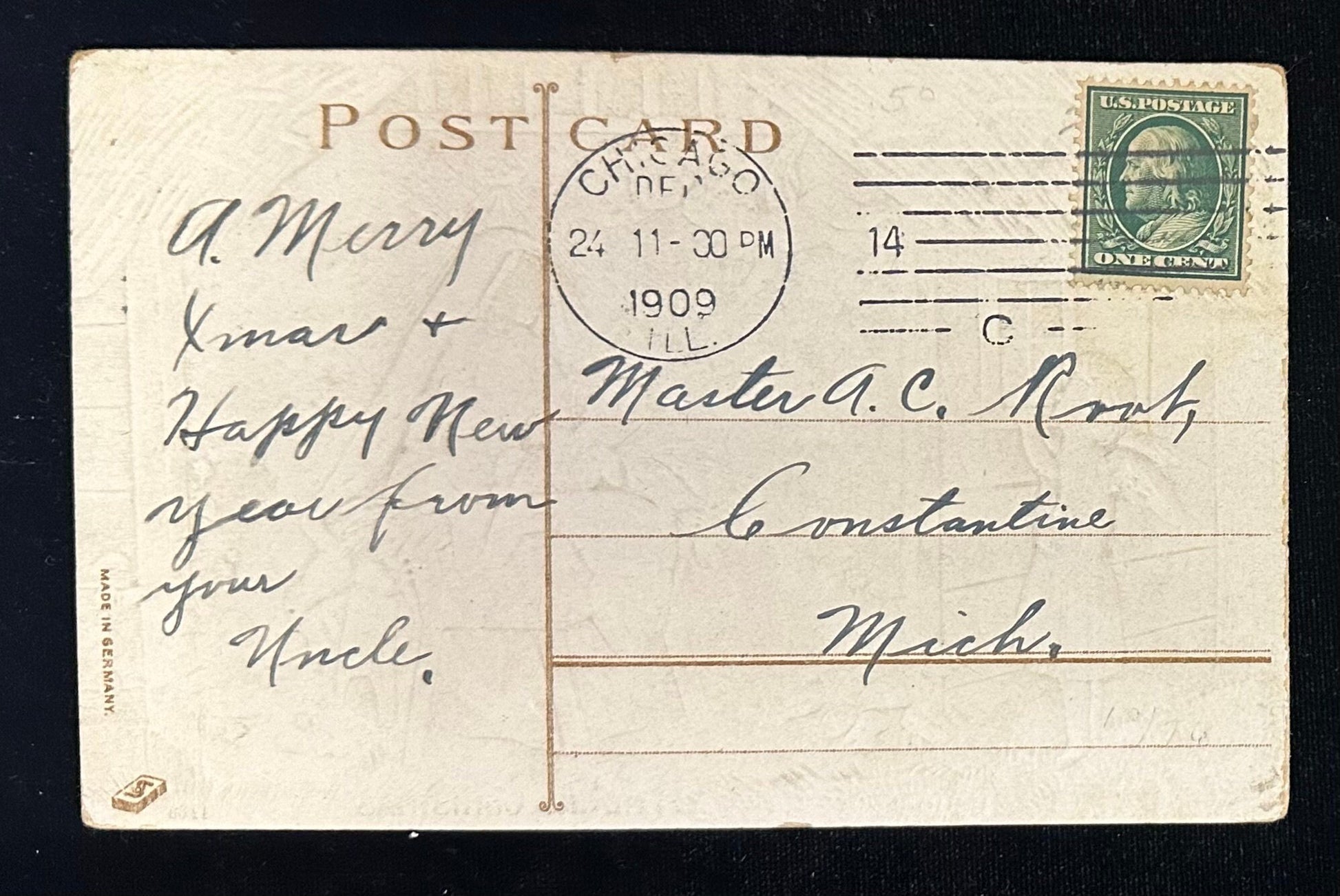 Vintage postcard with handwritten text and postage stamp, dated 1909.