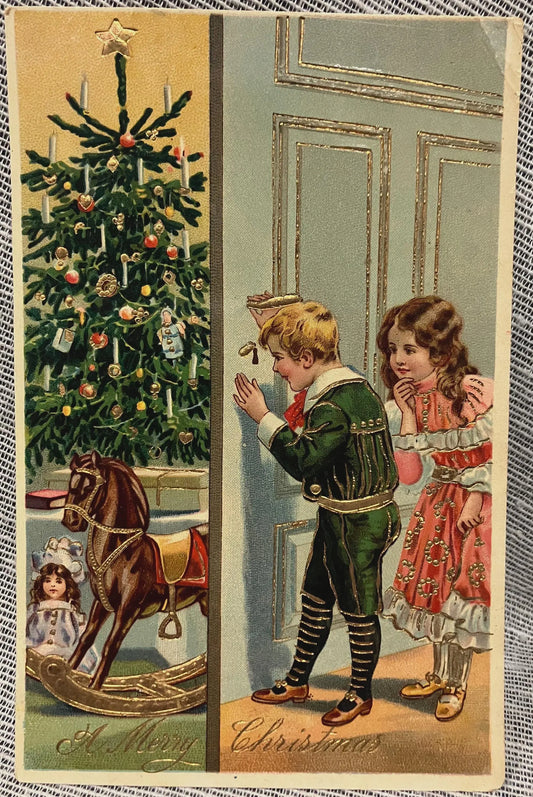Vintage Christmas card with children near a decorated tree and rocking horse.