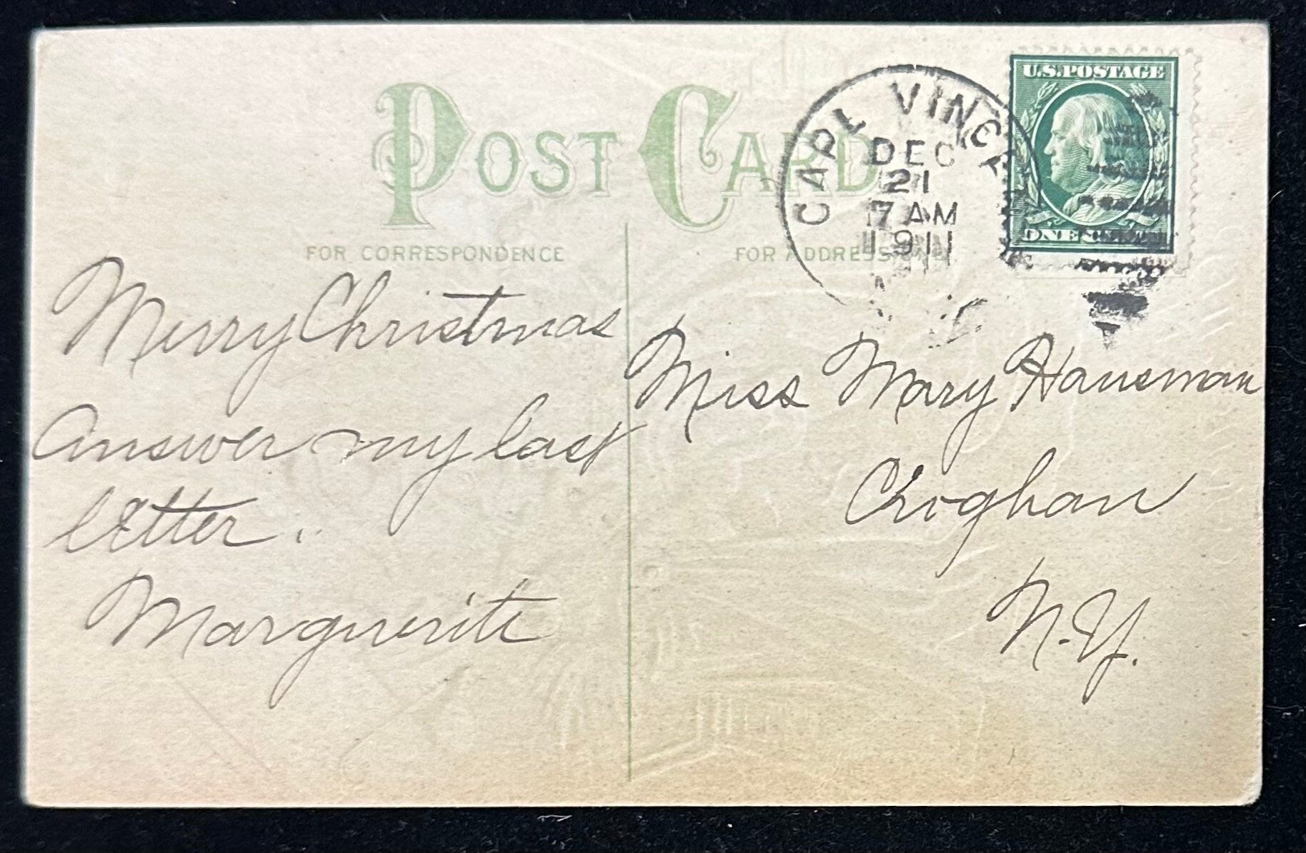 Vintage postcard with Christmas greeting and postage stamp, addressed to Miss Mary Hanman.