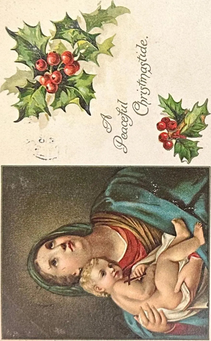 Vintage-style Christmas card with holly, 'A Peaceful Christmas,' and a depiction of a mother holding a child.