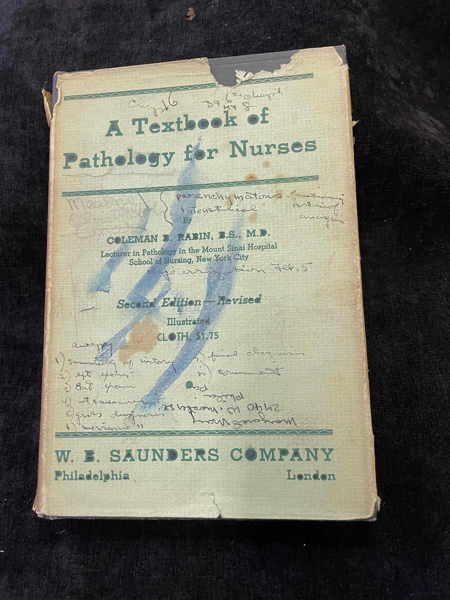Vintage book titled 'A Textbook of Pathology for Nurses' by W. E. Saunders Company on a dark background